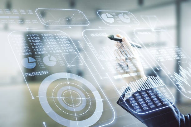 istock Double exposure of male hand with pen working with abstract virtual statistics data hologram on blurred office background, statistics and analytics concept 1218085093