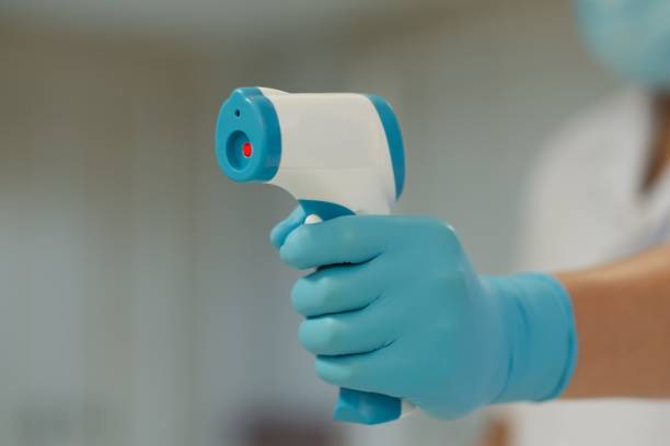 istock Medical staff use infrared forehead thermometer for check body temperature, Covid-19 outbreak concept 1218087581