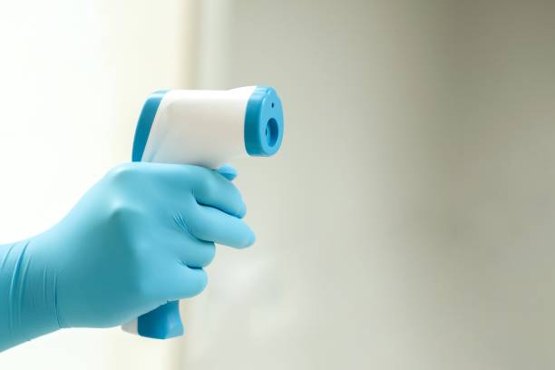 istock Medical staff use infrared forehead thermometer for check body temperature, Covid-19 outbreak concept 1218087587