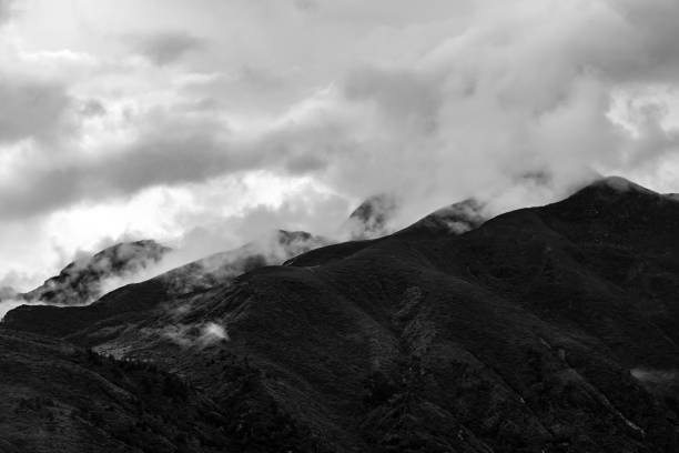 istock a beautiful mountain view with fog and clouds 1218087771