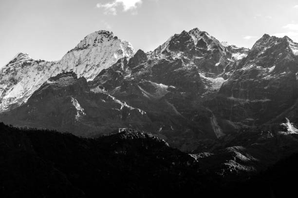 istock a beautiful mountain view with fog and clouds 1218087809
