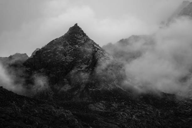istock a beautiful mountain view with fog and clouds 1218087810