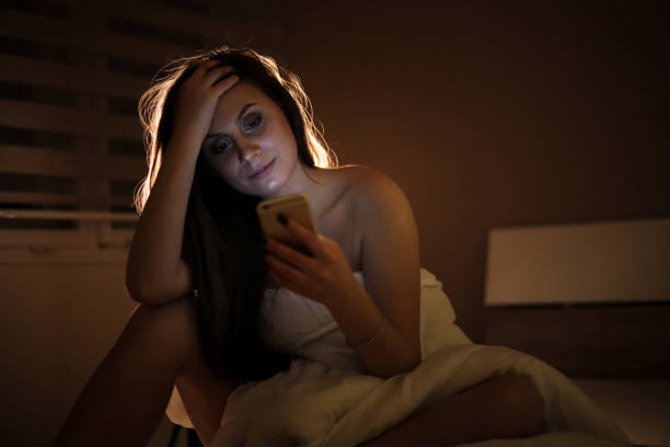 istock A woman in bed covered in a quilt 1218088467