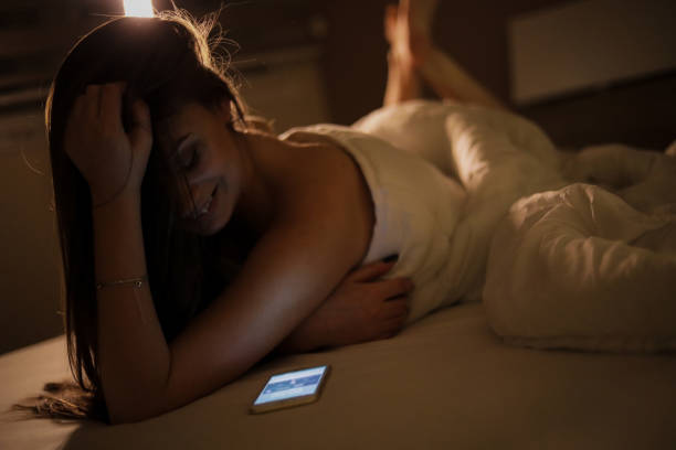 istock A woman in bed covered in a quilt 1218088529