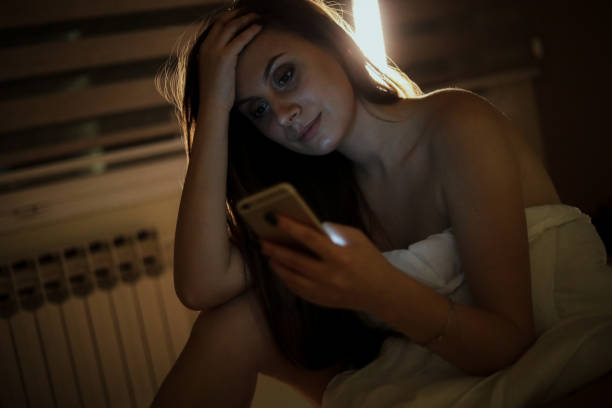 istock A woman in bed covered in a quilt 1218088602