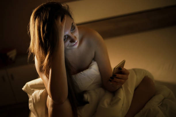 istock A woman in bed covered in a quilt 1218088645