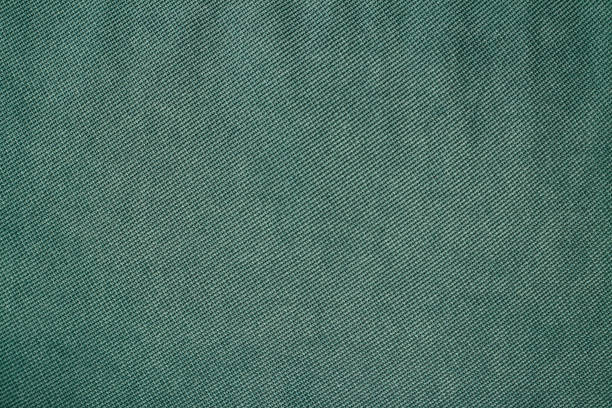 istock Green denim fabric seamless texture 1218089693