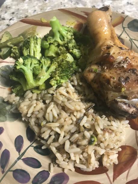 istock Dinner meal of chicken broccoli and rice 1218089813