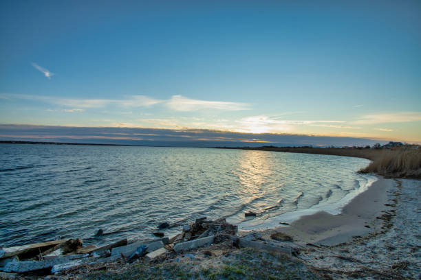 istock Cloudy sunrise over the bay #1 , Smith Point County Park, Shirley NY 1218091602