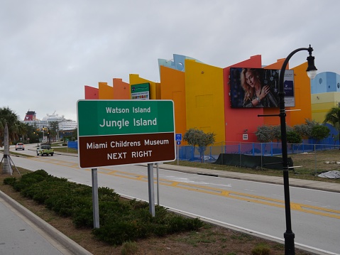 Miami, Florida- December 2018: Colorful directional signs on the roadside to Watson and Jungle Islands, and Miami Children's Museum.