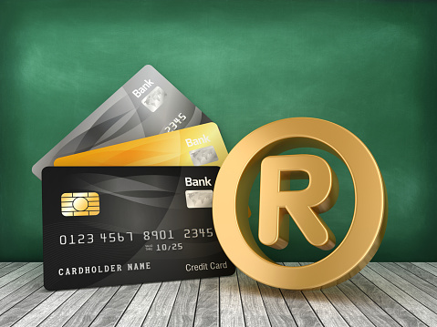 Credit Cards with Trademark Symbol on Chalkboard - 3D Rendering