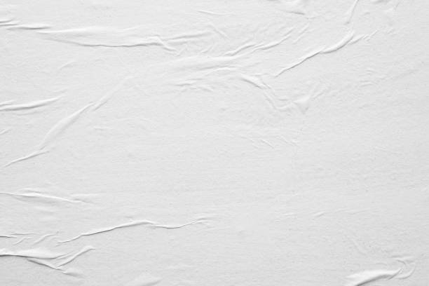 istock Blank white crumpled and creased paper poster texture background 1218104155