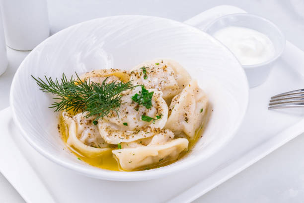 istock Dumplings with sour cream and herbs 1218104635