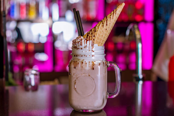 istock chocolate milkshake on wooden background 1218105332