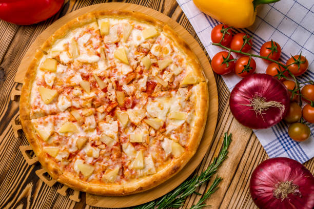 istock pizza Hawaiian with pineapple and chicken 1218105565