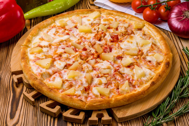 istock pizza Hawaiian with pineapple and chicken 1218105574