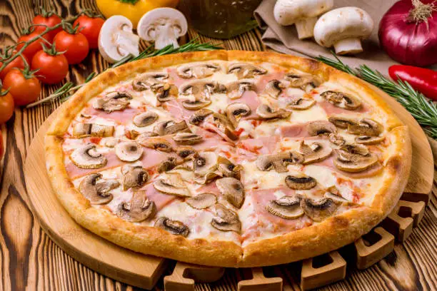 Photo of Pizza with ham and mushrooms