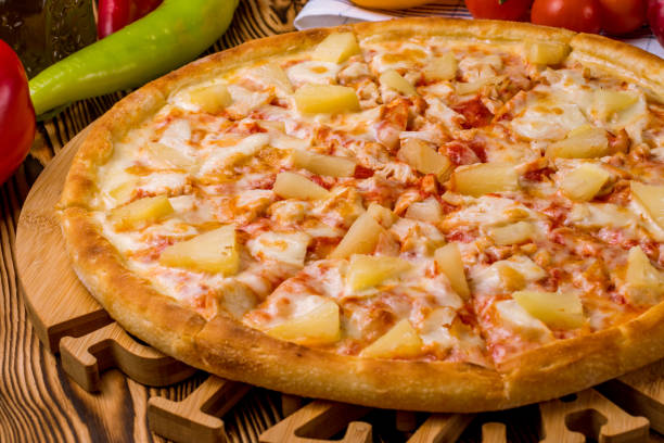 istock pizza Hawaiian with pineapple and chicken 1218105715
