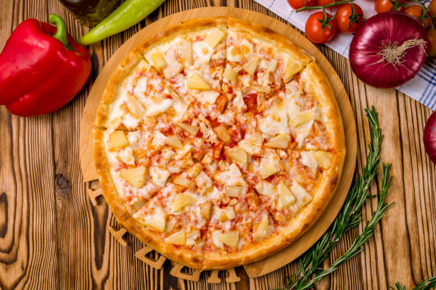 istock pizza Hawaiian with pineapple and chicken 1218105777