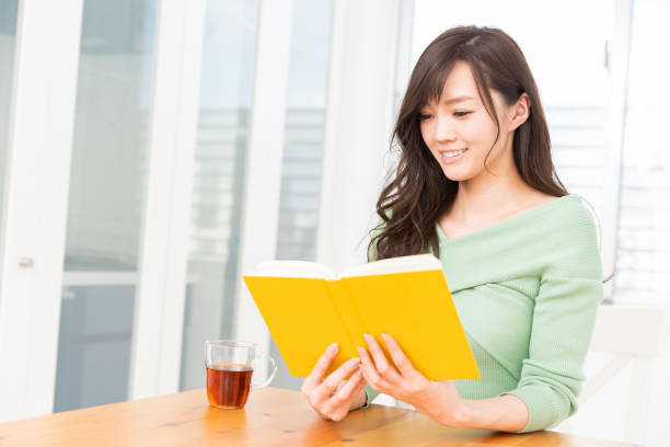 istock asian woman who reads a book 1218109844