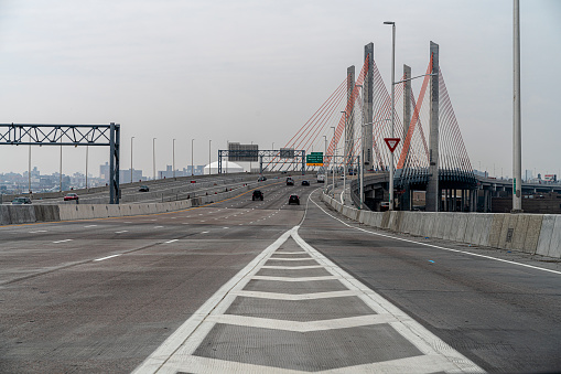 New York, NY, USA - April 8, 2020: Unusually light traffic on typically busy BQE at Kosciusko Bridge, Brooklyn, caused by the COVID-19 outbreak.