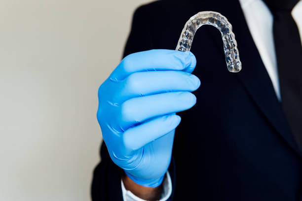 istock executive teaching his invisalign cosmetic orthodontics 1218109953