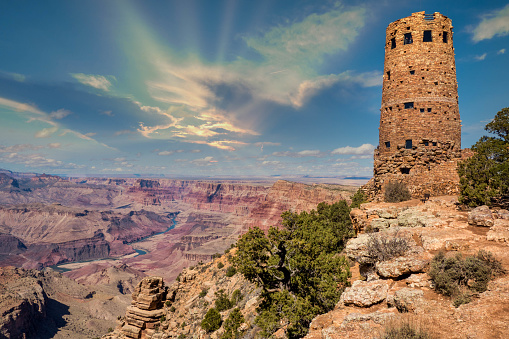 A daytime view of the Watchtower looking along the room of the Grand Canyon including the Colorado River