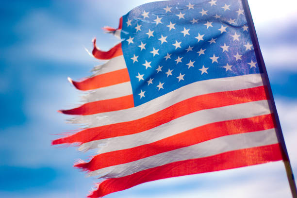 istock Tattered Old US Flag Waving 1218111542