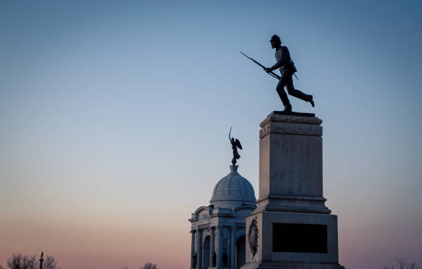 istock Civil war solider statues at dusk 1218115531