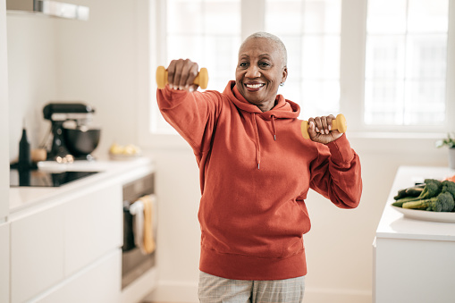 Senior women exercising at home