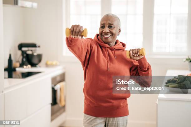 Senior Women Exercising At Home Stock Photo - Download Image Now - Exercising, Senior Adult, Healthy Lifestyle
