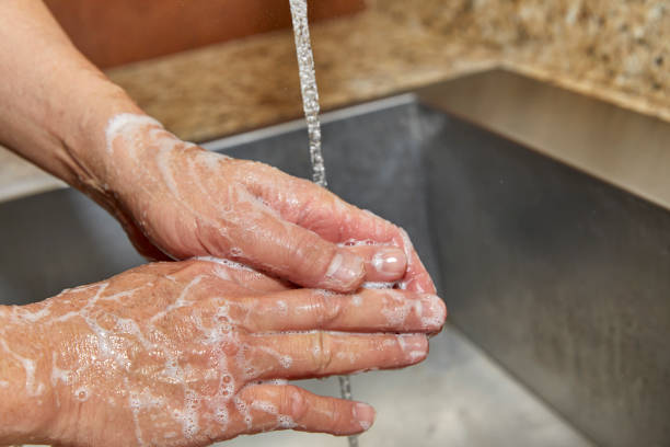 istock A Man's Hands with Soap and Water on Them 1218118997