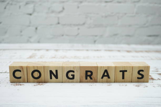 istock Congrats alphabet letter with space copy on wooden background 1218119073