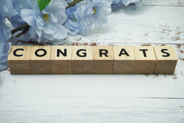 istock Congrats alphabet letter with space copy on wooden background 1218119094