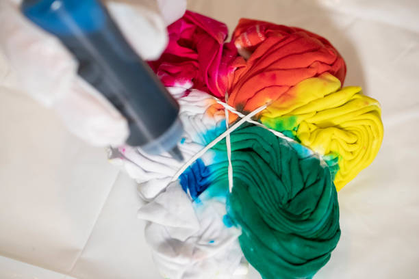 Tie dying a t shirt stock photo