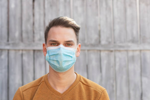 istock Young man with surgical mask 1218124070