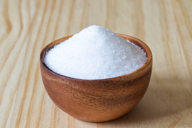 istock White sand sugar in wooden bowl 1218125156