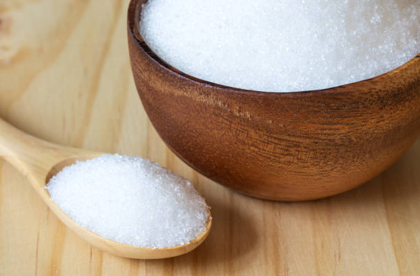 istock White sand sugar in wooden bowl 1218125159