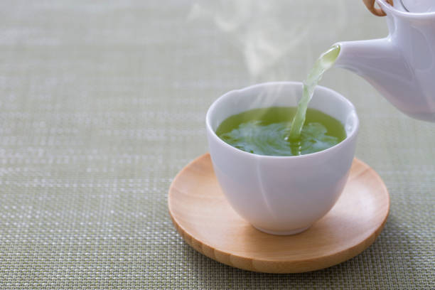 green tee - japanese tea cup stock-fotos und bilder