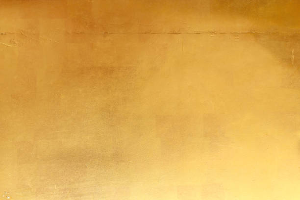istock Shiny yellow leaf gold foil texture background 1218126256