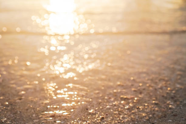 istock Blur beach with bokeh orange sunset theme color background. 1218128323