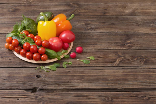 istock fresh vegetables on old wooden table 1218129237