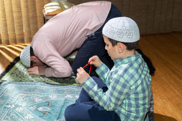 istock Family praying together in ramadan 1218130010