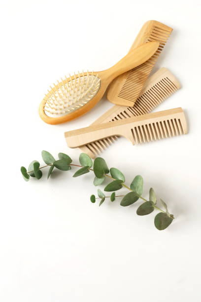 istock Wooden combs brush and head massage  isolated on white background. zero waste accessories. Top view. copy space 1218131291