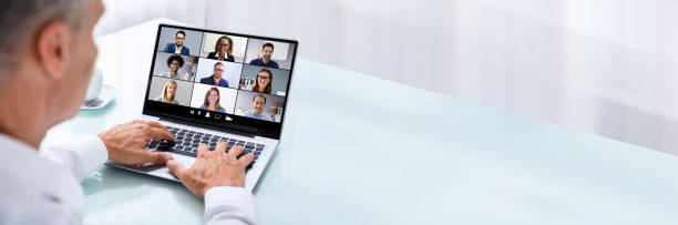 Businessman Videoconferencing With Colleague On Laptop