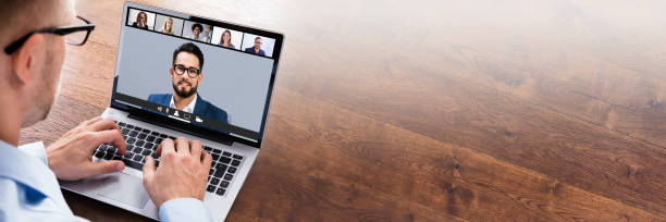 Businessperson Videoconferencing On Laptop