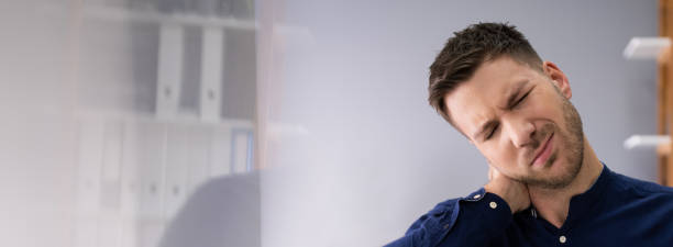 istock Businessman Suffering From Neck Pain 1218132516
