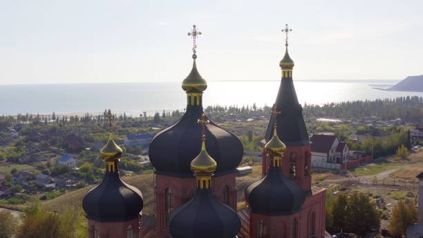 Church of the Archangel Michael with sea views - Aerial View Church of the Archangel Michael in the Left Bank district of the city on an summer day. Ukraine. Mariupol. Opened in 1997. mariupol stock pictures, royalty-free photos & images