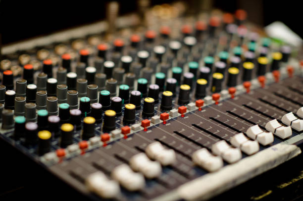 istock sound check for concert, mixer control, music engineer, backstage 1218135059