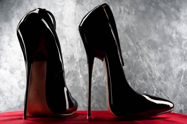 istock Black fetish shiny patent leather stiletto high heels with ankle strap 1218137171